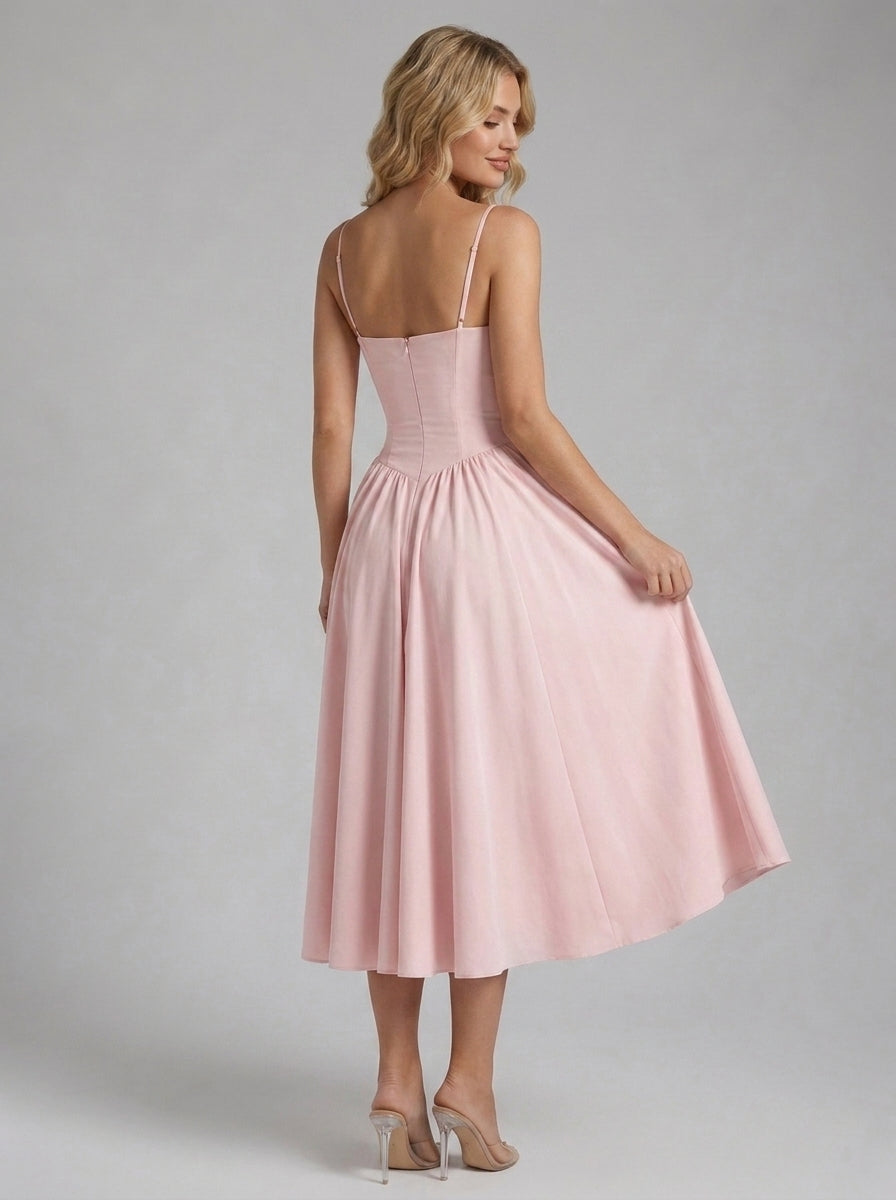 Beatrice Full Skirt Corset Midi Dress in Blush - front view with the full skirt held out