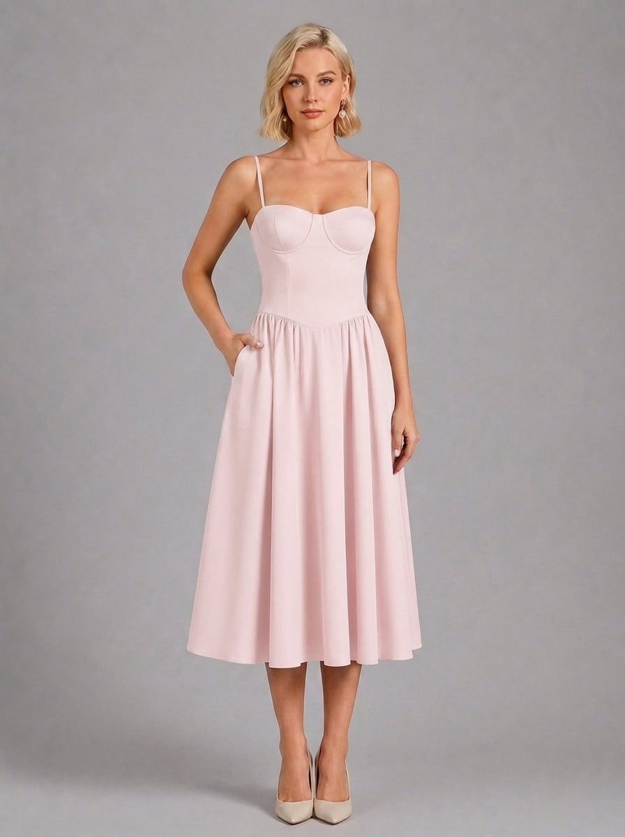 Florence Drop Waist Corset Midi Dress in plain Pink - front view with hand in the side pocket