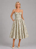 Florence Drop Waist Corset Midi Dress in Green Floral - front view with hands in the side pockets